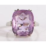 18 carat white gold ring set with a facet cut purple stone, ring size O, 5.6g