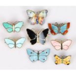 Eight silver and polychrome enamel decorated butterfly brooches, to include three Norwegian