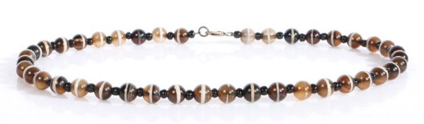 A banded agate necklace, with a row of beads to the strung necklace, 45cm long