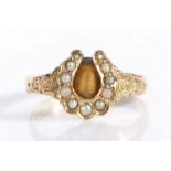 Victorian 22 carat gold ring, London 1870, the seed pearl set horseshoe form head flanked by