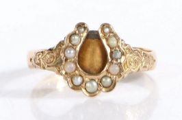 Victorian 22 carat gold ring, London 1870, the seed pearl set horseshoe form head flanked by