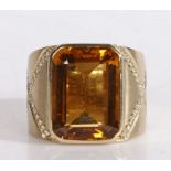 18 carat gold citrine and diamond ring, the central rectangular facet cut citrine housed in an 18