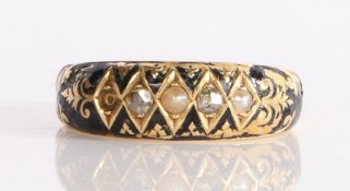 An elegant Victorian mourning ring having alternating seed pearls and diamonds, circa 1894-95, set