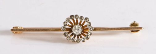A diamond set bar brooch, the diamond set head with diamond surround attached to the bar brooch, 3.6