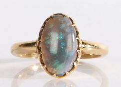 A black opal ring, the cabochon cut opal within a claw setting, 4.2 grams, ring size Q