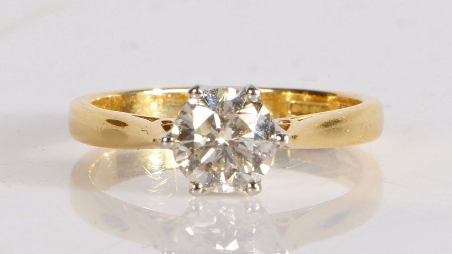 An 18 carat gold diamond solitaire ring, the round cut diamond at approximately 1 carat, 3.6