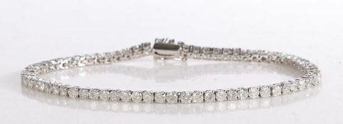 An elegant 9 carat white gold and diamond tennis bracelet, set throughout with round brilliant cut