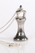 A sterling silver novelty fob pendant on a chain, signed L&S, weighing 18.35 grams. The fob in the