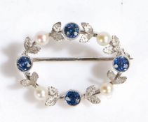 A pearl and sapphire set brooch, with four sapphires and four pearls to the leaf and oval brooch,