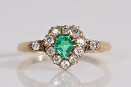 A 19th Century 18 carat gold and gem set ring, with a green pentagon cut stone to the centre, framed