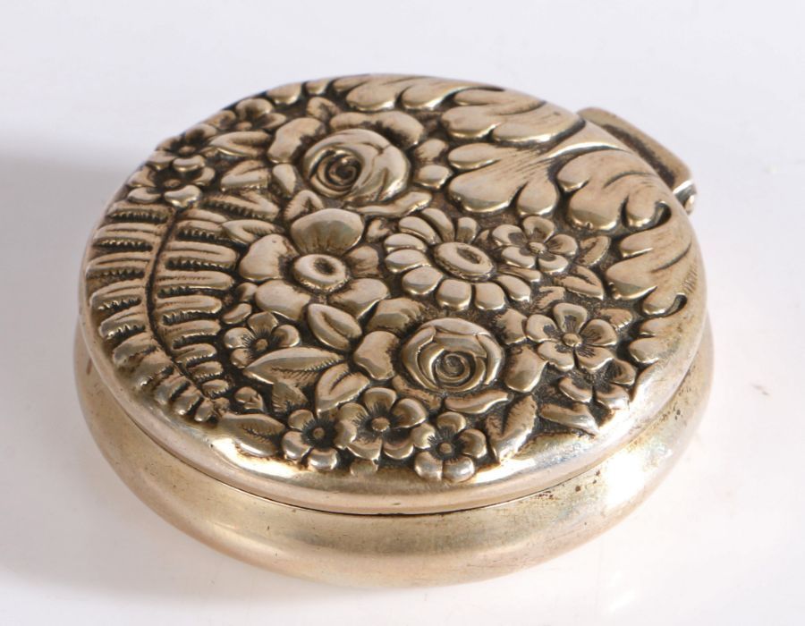 Tiffany & Co sterling silver powder compact, of circular form with embossed foliate cover, the