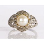 A cultured pearl and diamond ring, possibly Belle Epoque, having a large cultured pearl to the