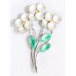 A silver and enamel flower brooch, comprised of three elegant silver stems each with a yellow and