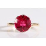 18 carat gold single stone ring, having a large round cut red stone, 5.53 grams, ring size W.