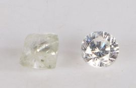 A parcel of two loose diamonds, one round brilliant cut at approximately 0.25 carat and one rough