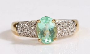 18 carat gold and Paraiba tourmaline ring, the central oval cut 1 carat Paraiba tourmaline set in an