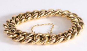 14 carat gold curb link bracelet, with links and clasp end and safety chain, 31.1g, 19cm long