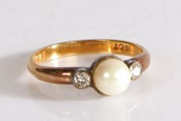 An 18 carat gold pearl and diamond set ring, the central pearl flanked by a pearl to either side,