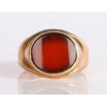 A 19th Century oval cut carnelian ring, set across the width of the ring in a raised mount, 4.09