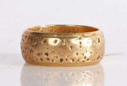A 9 carat gold hammered band, 5.46 grams, ring size J 1/2.