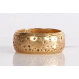 A 9 carat gold hammered band, 5.46 grams, ring size J 1/2.