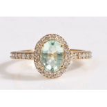 18 carat gold and Paraiba tourmaline ring, having an oval cut Paraiba tourmaline weighing 1.