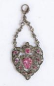 A pretty 19th Century silver diamond and paste heart pendant, having a pink paste heart with diamond