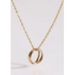 A Cartier Trinity pendant, in 18 carat white, yellow and rose gold, signed Cartier, on original fine