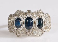 White metal diamond and topaz plaque ring, having three graduated oval cut topaz stones framed by an