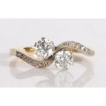 18 carat gold diamond and cubic zirconia ring, the head set with two crossover cubic zirconia and