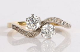 18 carat gold diamond and cubic zirconia ring, the head set with two crossover cubic zirconia and