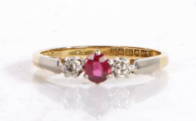 18 carat platinum set ruby and diamond ring, the central ruby flanked by two diamonds, ring size