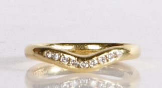 An 18 carat gold diamond set ring, with nine diamonds to the arched shank head, 3.8 grams, ring size