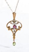 Art Nouveau pendant necklace, the peridot, garnet and seed pearl set pendant on a 9 carat gold