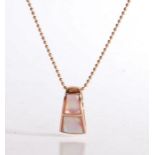 14 carat rose gold and shell pendant on a 14 carat rose gold ball chain, weighing 8.71 grams. The