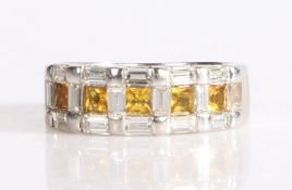 18 carat white gold and diamond ring, comprised of five yellow square cut diamonds, each framed by