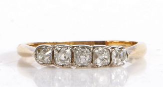 Antique unmarked yellow and white metal ring, the head set with five diamonds, ring size K1/2, 1.8g