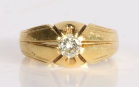 An 18 carat gold gentleman's diamond set ring, the raised head containing a round cut diamond with