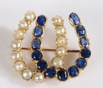 A pearl and sapphire dual brooch, the dual horseshoe set with thirteen pearls and thirteen