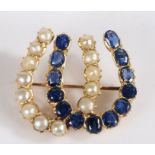 A pearl and sapphire dual brooch, the dual horseshoe set with thirteen pearls and thirteen