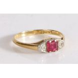 18 carat gold ruby and diamond set ring, the central ruby flanked by a diamond to either side, 1.8