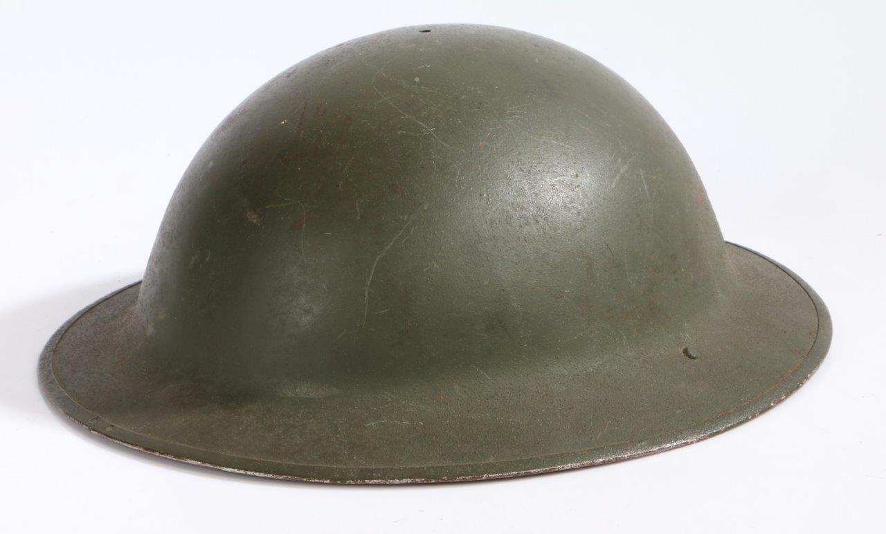 Second World War British Mk II helmet shell, dated 1940 on the strap bale, stamped 'J.S.S.' for