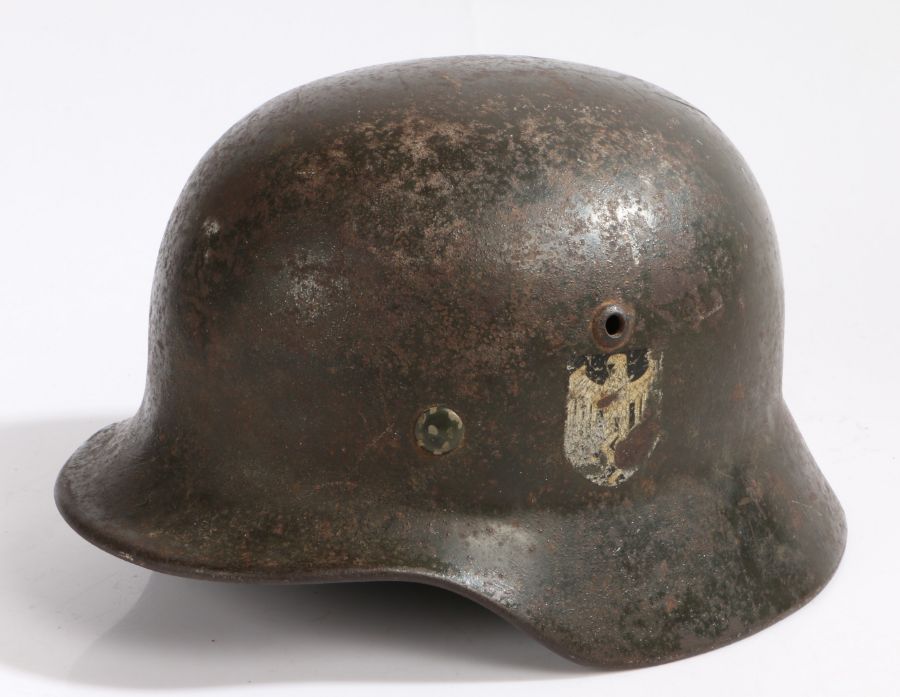 Second World War German M35  steel helmet, originally double decal one has been scratched off