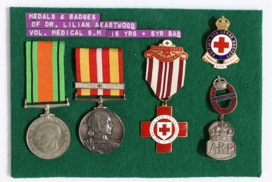 Second World War trio of medals, the Defence Medal, British Red Cross Service Medal with one bar,