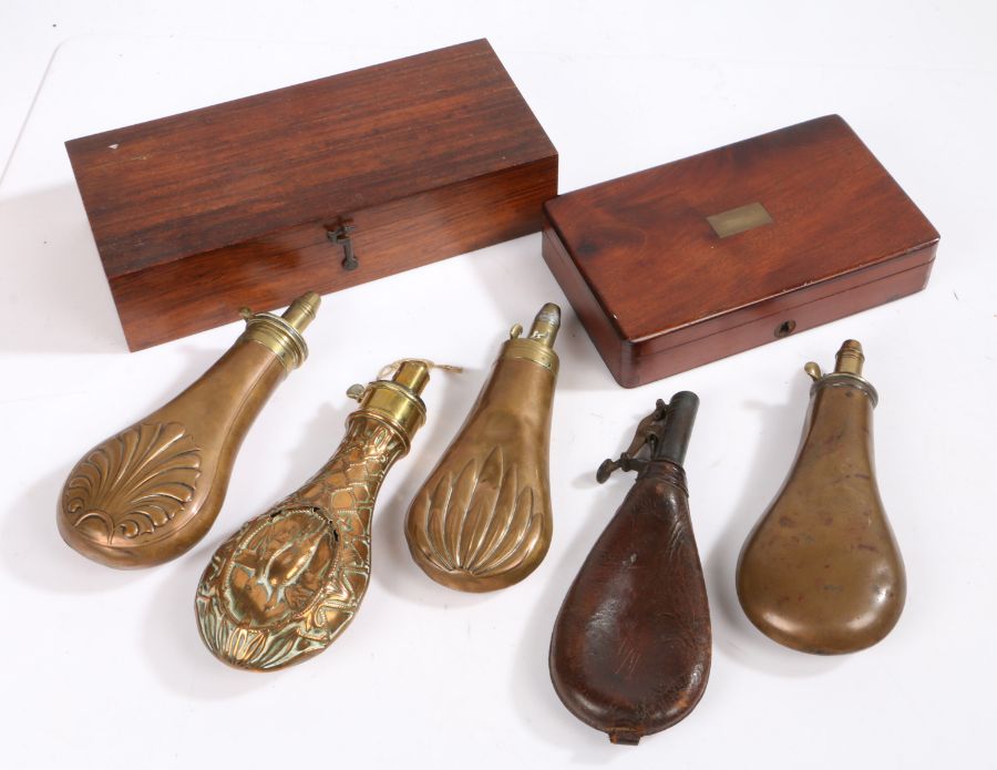 Four copper and brass powder flasks marked to 'Sykes', 'I.P. Cutts', 'James Dixon & Sons,