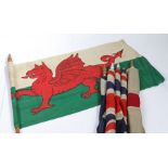 A selection of Early 20th century British patriotic flags, printed on bunting material, mounted on