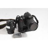 Nikon D5000 camera with Nikon DX 55-200mm 1.4-5.6G lens, battery grip and additional Nikon AF NIKKOR