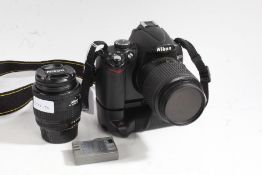 Nikon D5000 camera with Nikon DX 55-200mm 1.4-5.6G lens, battery grip and additional Nikon AF NIKKOR