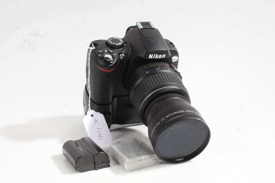 Nikon D60 camera with Nikon DX18-55mm 1:3.5-5.6 lens and battery grip