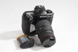 Nikon D1x camera with Sigma APO DG 70-300mm 1:4-5.6 lens and battery grip